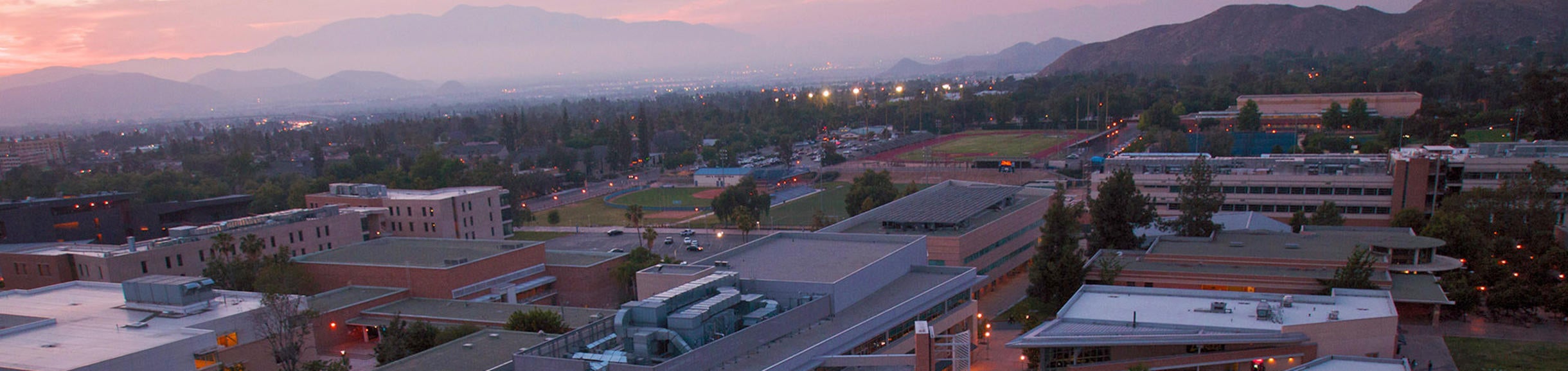 Aerial view of the HUB at dusk (c) UCR