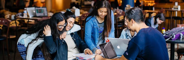 students at a table (c) UCR